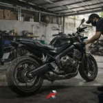 Big bike maintenance in a tropical climate Philippines garage with mechanic servicing a sport touring motorcycle inside a small workshop