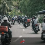 Motorcycle commuters and delivery riders on a Philippine road representing Honda 1 million motorcycle sales Philippines and commuter motorcycle culture