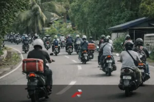Motorcycle commuters and delivery riders on a Philippine road representing Honda 1 million motorcycle sales Philippines and commuter motorcycle culture