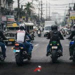 Motorcycles riding in Manila traffic representing Honda Yamaha Suzuki Kawasaki Philippine motorcycle market share and motorcycle industry growth