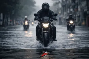 Motorcycle riding through flooded Philippine street during monsoon season showing best touring tire Philippine monsoon wet road performance