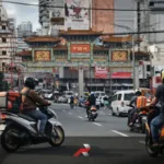 Scooter riders on a busy Divisoria Manila road showing why scooters dominate the Philippine motorcycle market for daily transportation