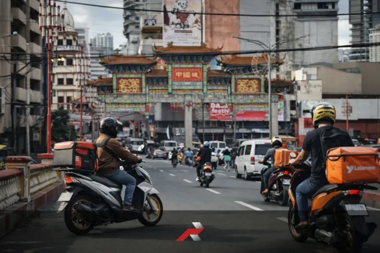Scooter riders on a busy Divisoria Manila road showing why scooters dominate the Philippine motorcycle market for daily transportation