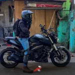 Rider beside Kawasaki Dominar 400 in Philippine street representing downgrade big bike daily riding Philippines decision