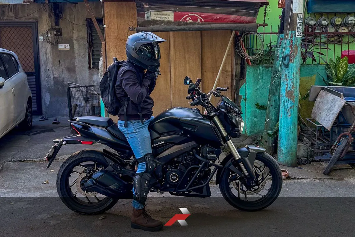 Rider beside Kawasaki Dominar 400 in Philippine street representing downgrade big bike daily riding Philippines decision