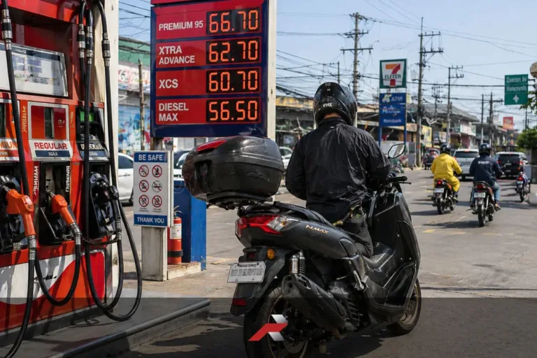Scooter rider refueling at a gasoline station in heavy Philippine traffic showing real world fuel efficiency conditions