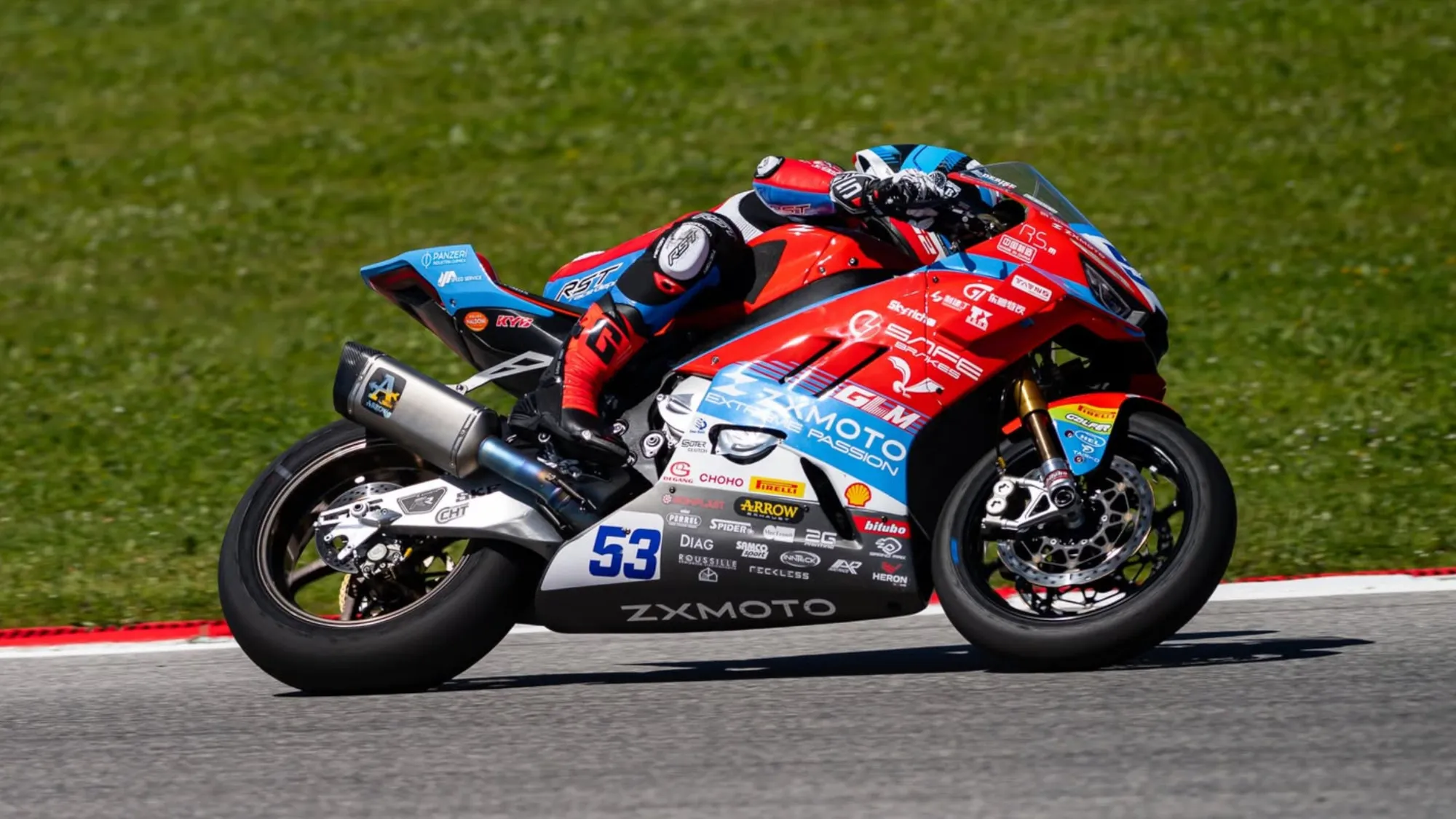 ZX Moto WSBK Motor Champion race bike leaning in high-speed corner during superbike race