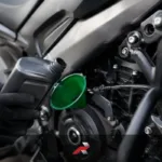Close-up of big bike engine oil being added to a Dominar-style motorcycle during maintenance