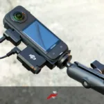 DJI Mic Mini motorcycle review setup with receiver connected to Insta360 X4 on handlebar mount