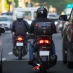 Loose motorcycle plate in the Philippines featured image showing a rear view of a motorcycle in traffic with the plate slightly emphasized and unreadable