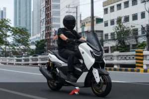 Yamaha Nmax CVT Maintenance Guide image showing a rider driving an Nmax Tech in a Manila city setting