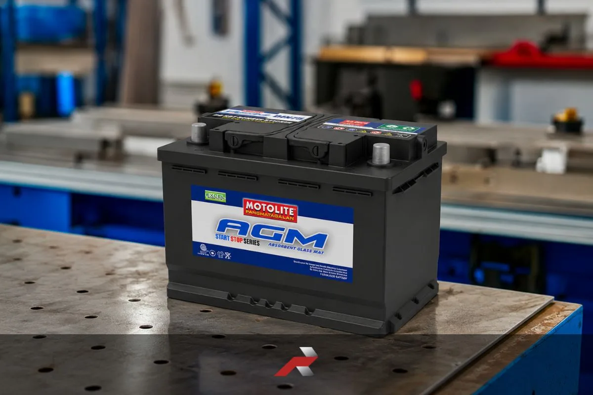 AGM battery vs conventional battery Philippines featured image showing an AGM motorcycle battery placed on a workshop table