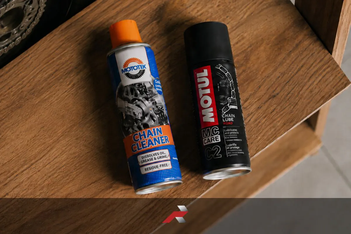 Best Chain Cleaner and Chain Lube Philippines featuring Mototek Chain Cleaner and Motul C2 Chain Lube beside a motorcycle sprocket