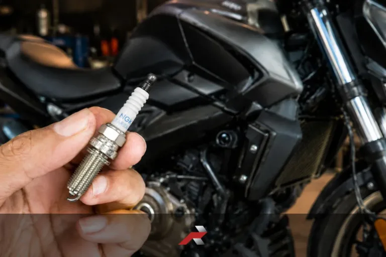 Dominar 400 spark plug replacement cost Philippines shown with NGK iridium spark plug and motorcycle background