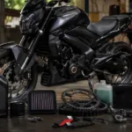 Dominar maintenance parts list Philippines showing oil filter, spark plugs, chain, sprocket, brake pads, battery, coolant, air filter, and engine oil for PMS