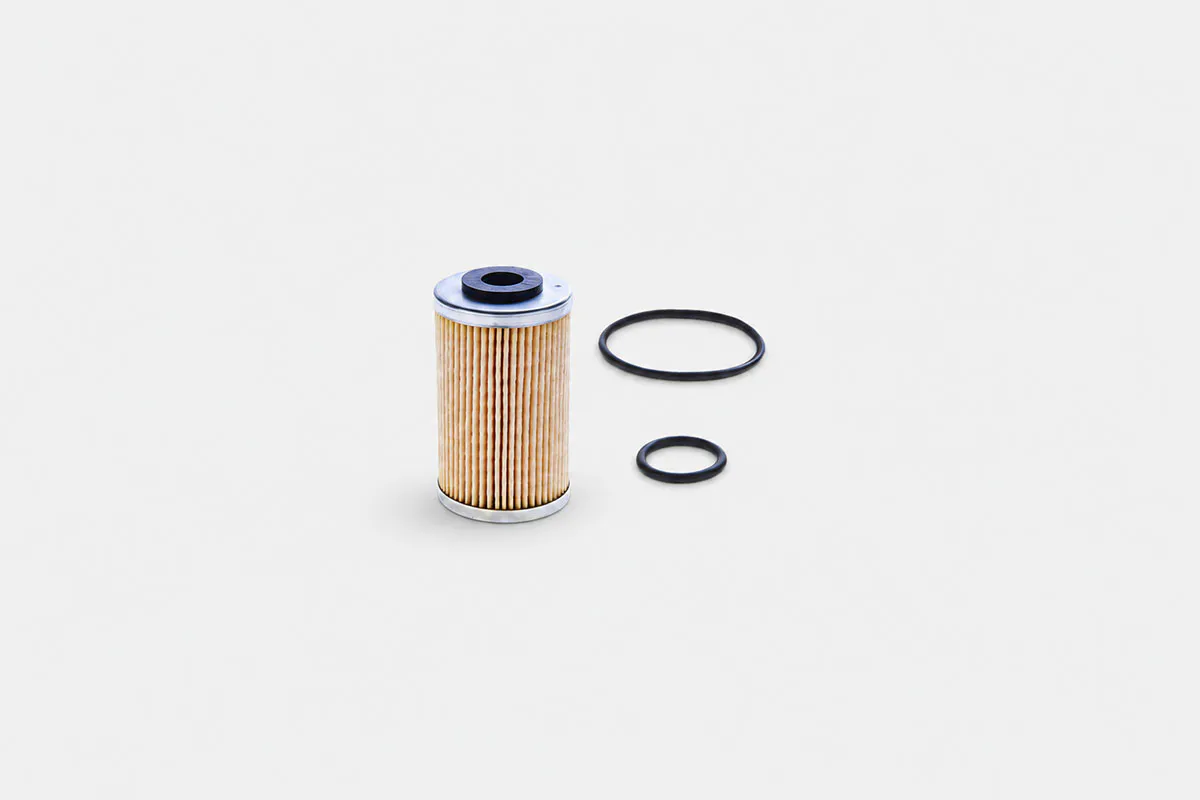 Kawasaki Dominar 400 oil filter beside engine oil for daily PMS maintenance in Philippine riding conditions