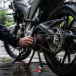 Motorcycle chain maintenance tropical climate Philippines with rear sprocket and chain cleaning after wet road riding