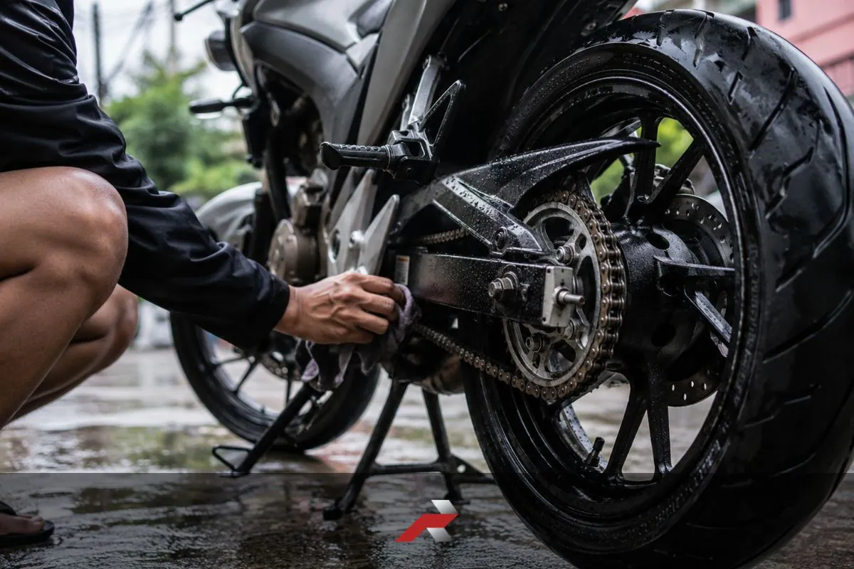 Motorcycle chain maintenance tropical climate Philippines with rear sprocket and chain cleaning after wet road riding